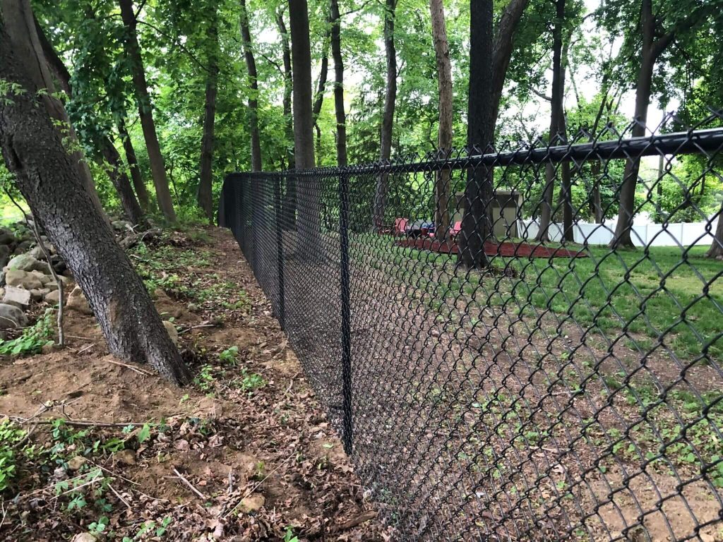 Black Vinyl-Coated Chain Link in Sherman, CT - Is It Worth Upgrading from Galvanized? 1 Chain-link Fence Installation in Roxbury, CT